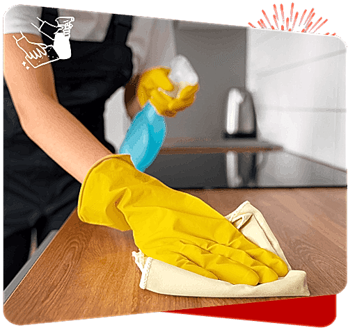 Disinfection cleaning with yellow rubber gloves and cloth in a modern kitchen.