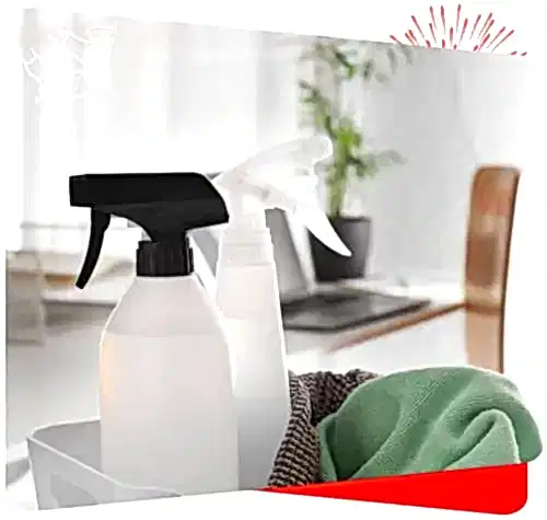 Spray bottles with cleaning supplies for home disinfecting and surface cleaning.