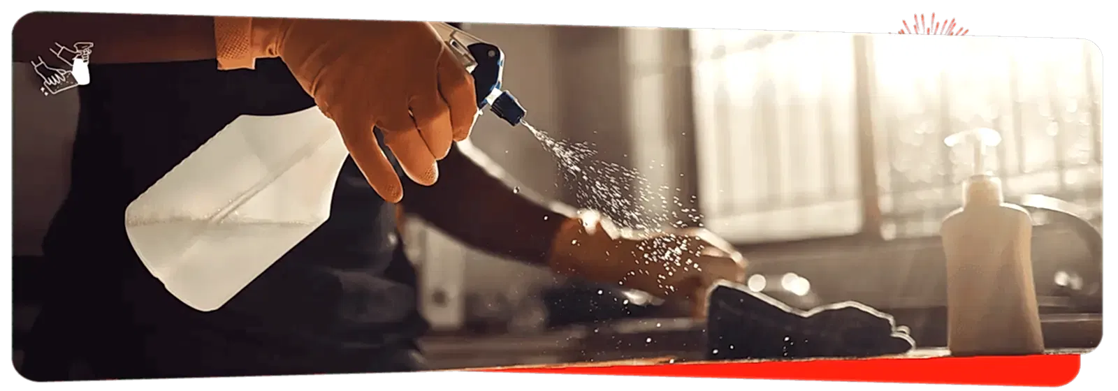 Spray bottle with cleaning solution for home cleaning or disinfecting services.